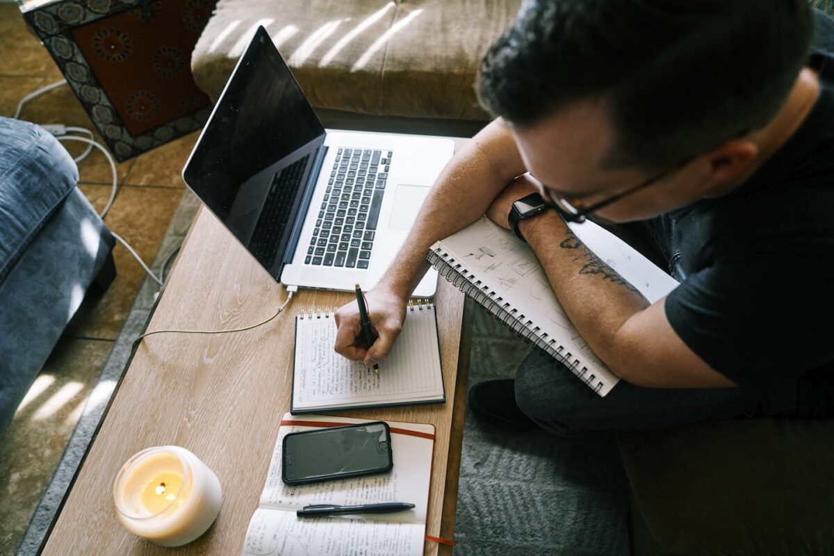 Content creator using a laptop to manage a monetized audience and membership site